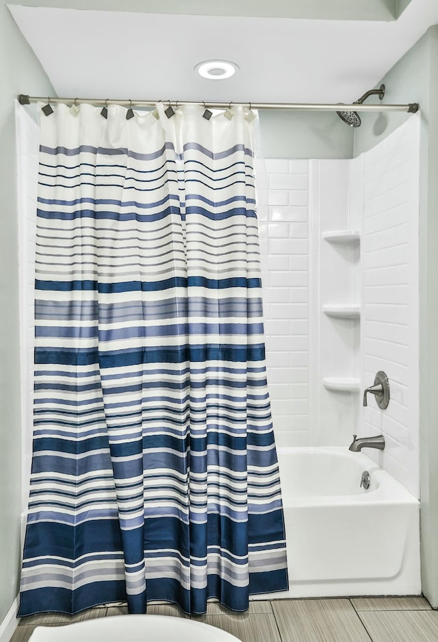 bathroom featuring shower / bathtub combination with curtain