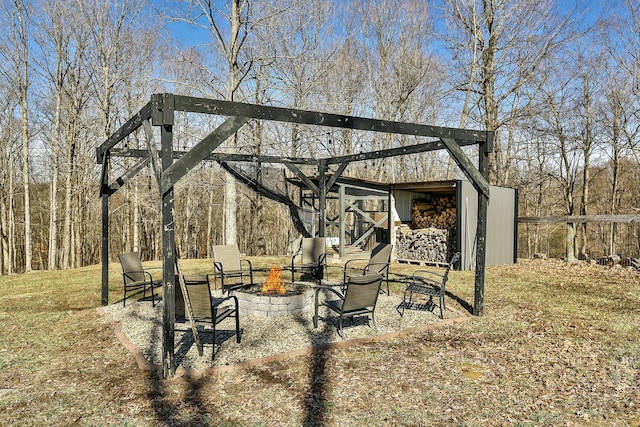 view of yard with an outdoor fire pit