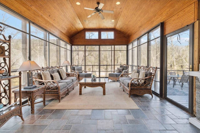 sunroom / solarium featuring ceiling fan, a wealth of natural light, vaulted ceiling, and wooden ceiling