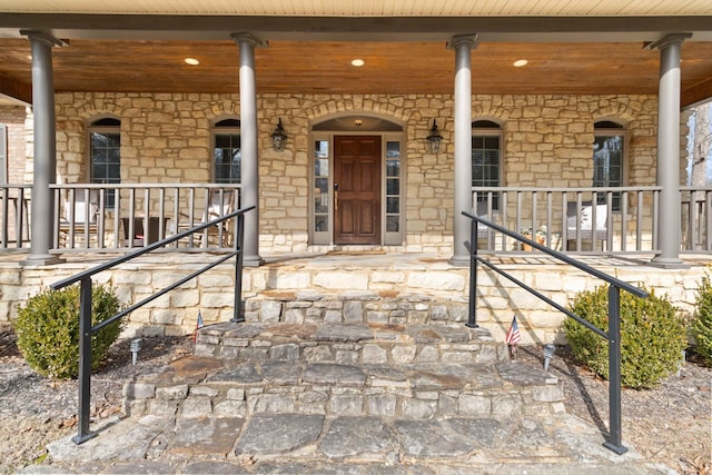 entrance to property featuring a porch