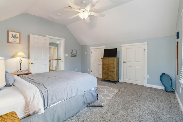 carpeted bedroom with vaulted ceiling and ceiling fan