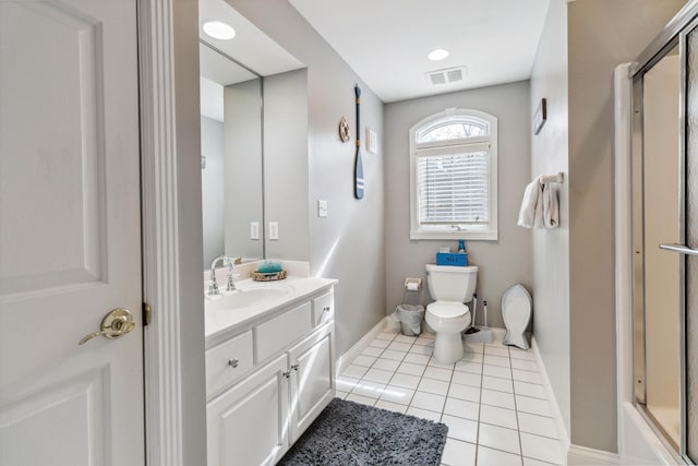 bathroom with vanity, tile patterned floors, and toilet