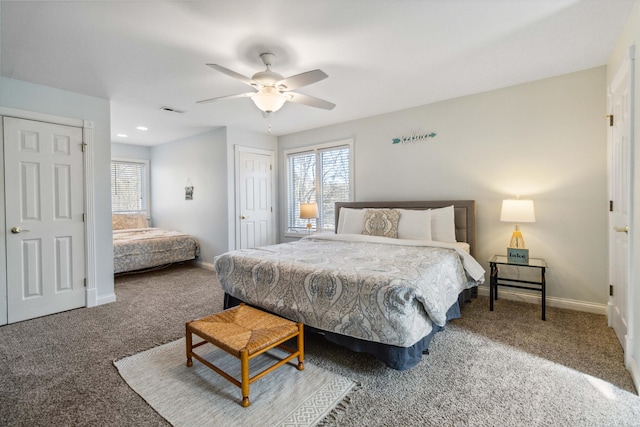 bedroom featuring ceiling fan, carpet flooring, and multiple windows