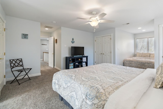 carpeted bedroom with ceiling fan and a closet