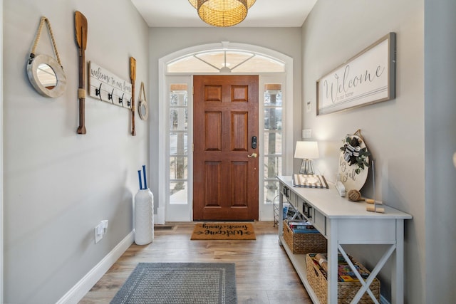 foyer entrance with light hardwood / wood-style floors