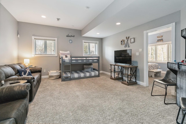 carpeted living room with a healthy amount of sunlight