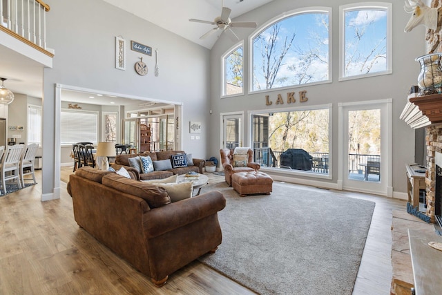 living room with a wealth of natural light and light hardwood / wood-style flooring