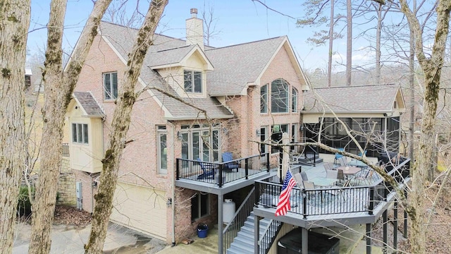 back of house with a wooden deck