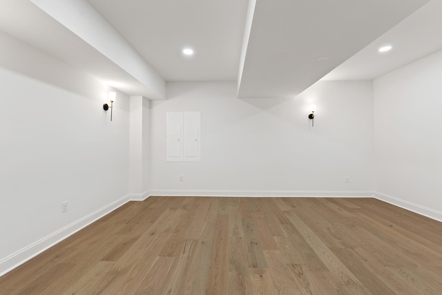 basement with light hardwood / wood-style floors