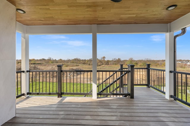 wooden deck with a rural view