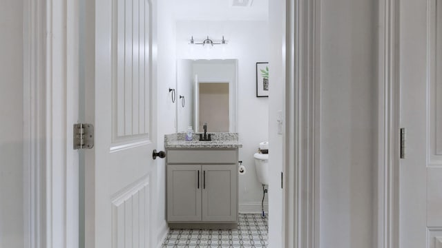 bathroom with vanity and toilet