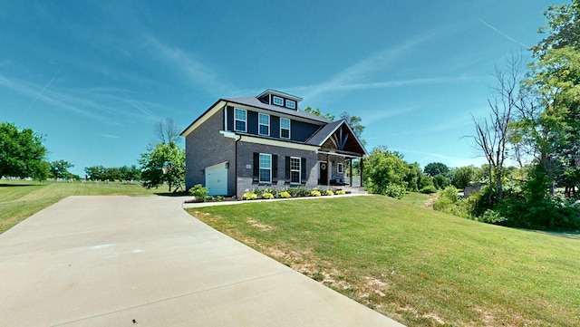 view of front of home with a garage and a front lawn