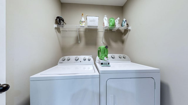 washroom featuring washer and clothes dryer