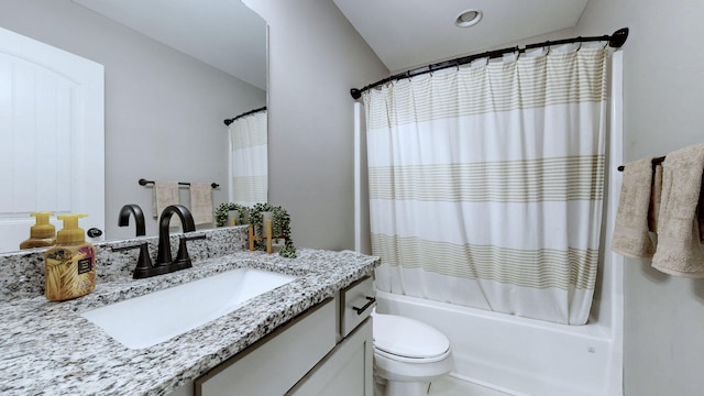 full bathroom with vanity, toilet, and shower / bath combo with shower curtain