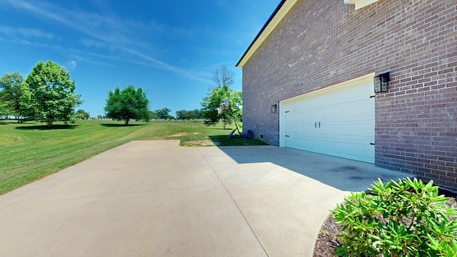 view of property exterior with a garage and a lawn