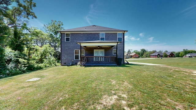 back of property featuring a lawn