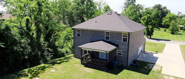 rear view of house with a yard