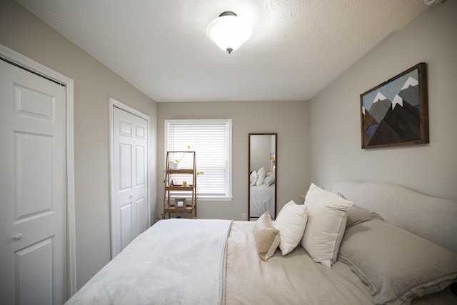 bedroom with a closet and a textured ceiling