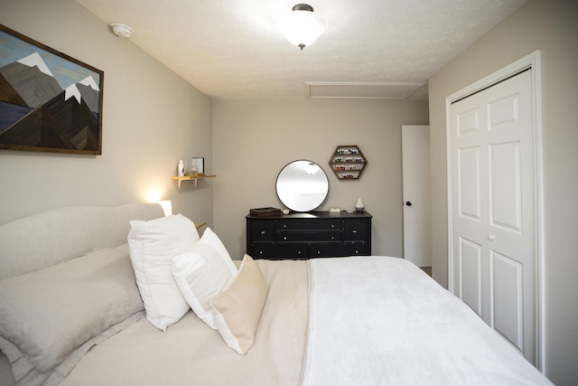 bedroom featuring a textured ceiling