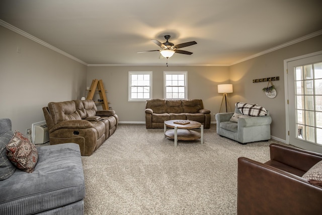 carpeted living room featuring ceiling fan and ornamental molding