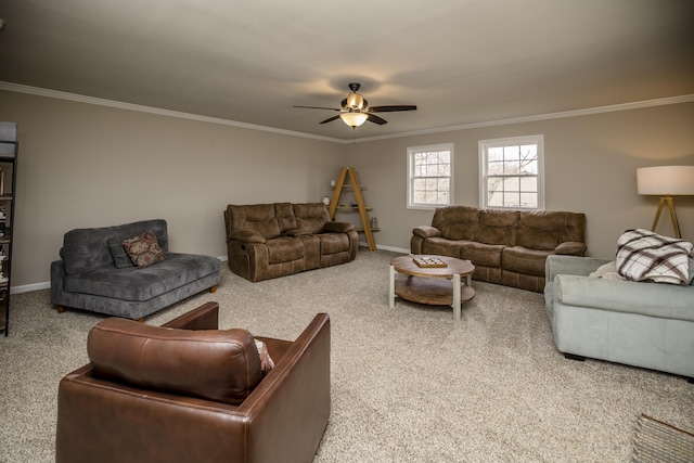 living room featuring ornamental molding, carpet, and ceiling fan