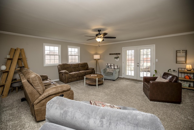 living room with light carpet, crown molding, french doors, and a healthy amount of sunlight