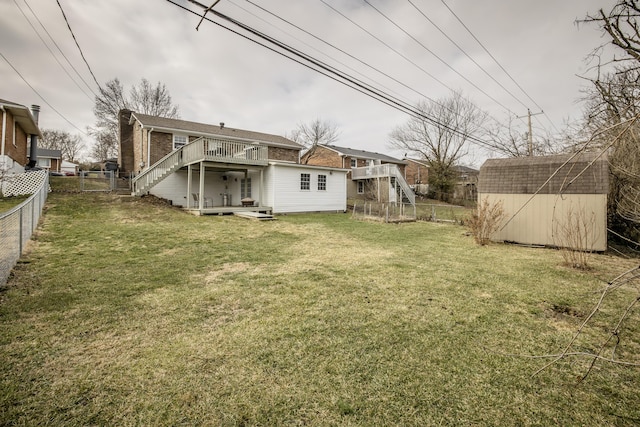 view of yard featuring a deck and a shed