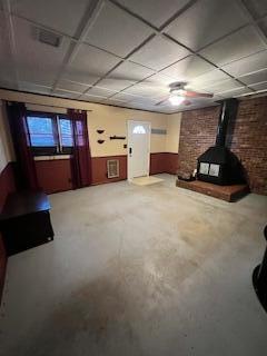 5 Keeton Ave, West Liberty, KY 41472 - finished below grade area featuring a wood stove and a paneled ceiling