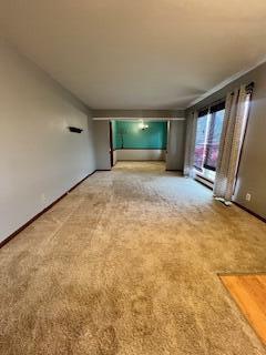 5 Keeton Ave, West Liberty, KY 41472 - unfurnished living room with light colored carpet and baseboards