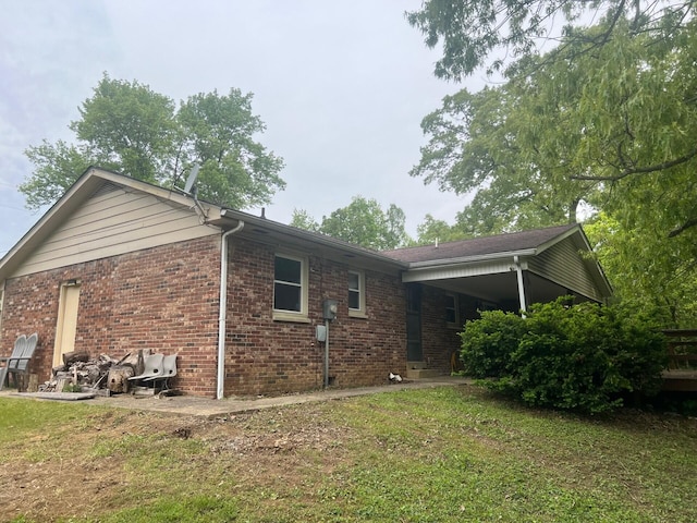 5 Keeton Ave, West Liberty, KY 41472 - view of property exterior featuring brick siding and a yard