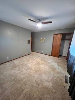 5 Keeton Ave, West Liberty, KY 41472 - unfurnished bedroom with light colored carpet, ceiling fan, a closet, and baseboards