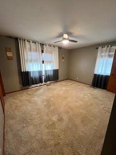 5 Keeton Ave, West Liberty, KY 41472 - spare room featuring plenty of natural light, a ceiling fan, carpet floors, and baseboards