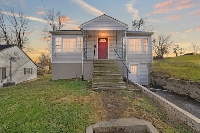 view of front of home with a lawn