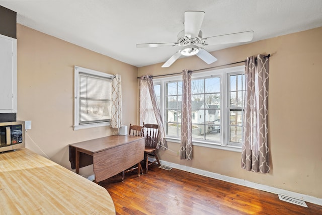 office area featuring ceiling fan and dark hardwood / wood-style flooring