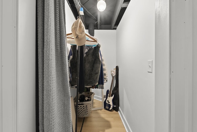 spacious closet featuring wood finished floors