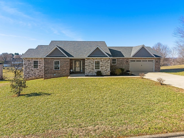 view of front of property with a garage and a front lawn