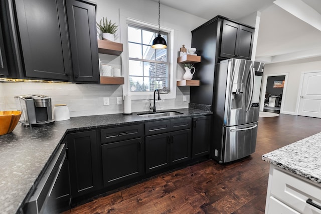 kitchen with sink, stainless steel fridge, dishwasher, dark hardwood / wood-style flooring, and decorative backsplash