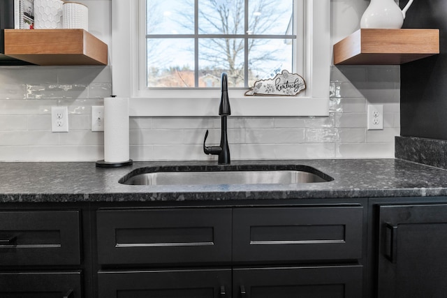 kitchen with tasteful backsplash and sink