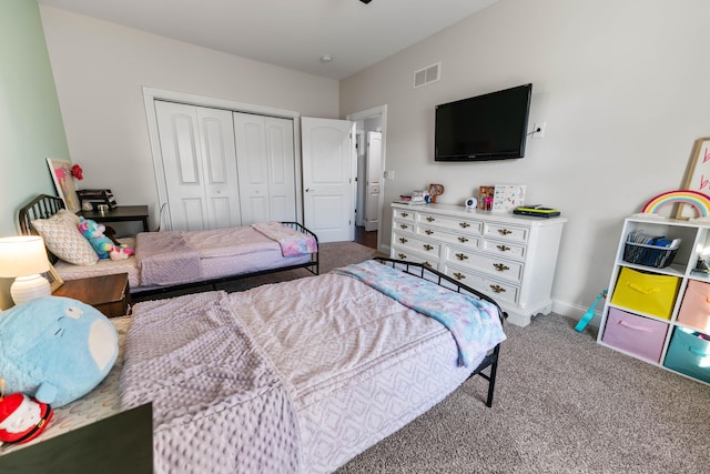 carpeted bedroom with a closet