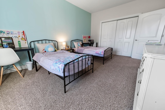 bedroom with carpet floors and a closet