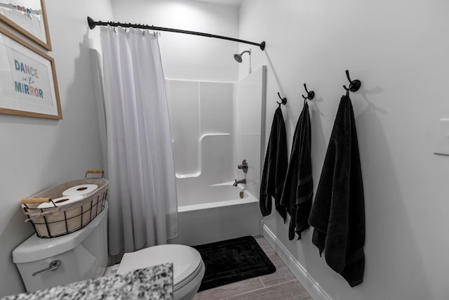 bathroom with shower / tub combo with curtain and toilet