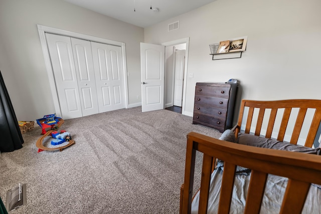 carpeted bedroom with a closet