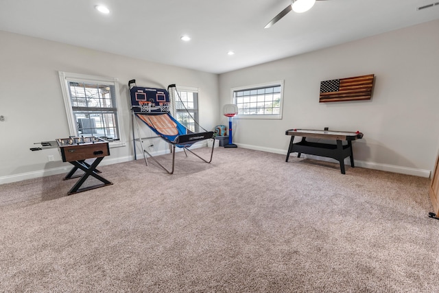 playroom with carpet and ceiling fan