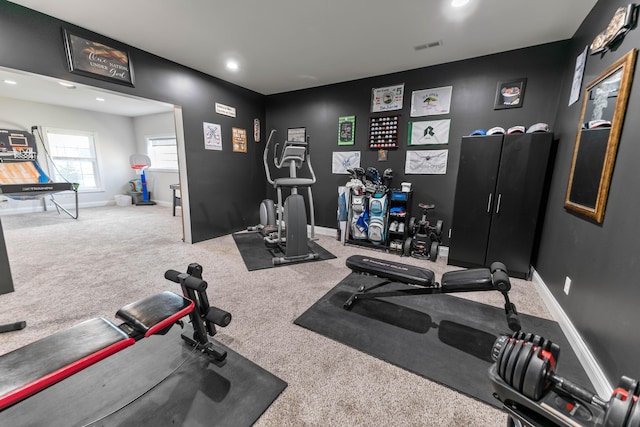 exercise room with carpet flooring