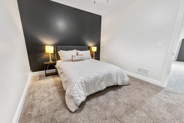 bedroom featuring light colored carpet