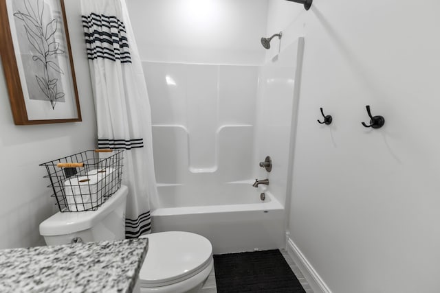 bathroom featuring shower / bathtub combination with curtain and toilet