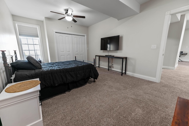 bedroom featuring ceiling fan, carpet floors, and a closet