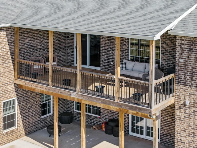 wooden terrace with a patio