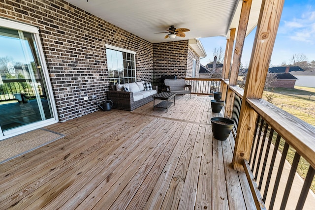 deck with ceiling fan and outdoor lounge area