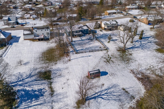 snowy aerial view featuring a residential view